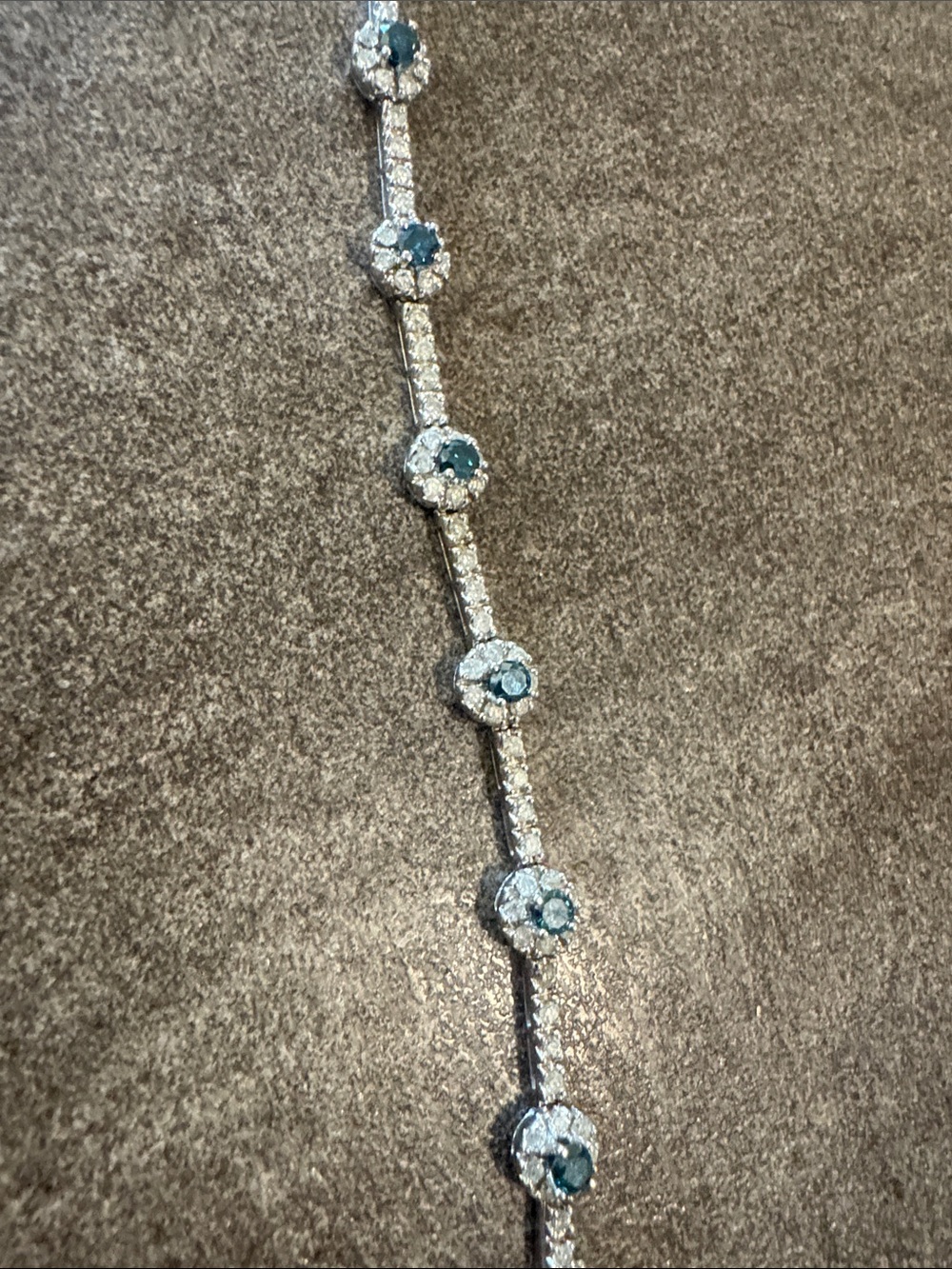 14 k solid gold luxurious women’s tennis Bracelet with blue and white diamonds